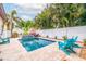 Beautiful private pool with tropical landscaping and lounge chairs at 310 8Th N Ave, St Petersburg, FL 33701