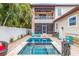 Beautiful private pool with tropical landscaping and an outdoor bar area at 310 8Th N Ave, St Petersburg, FL 33701