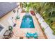 Aerial view of a private pool with travertine deck and tropical landscaping at 310 8Th N Ave, St Petersburg, FL 33701