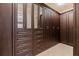 A luxurious walk-in closet with custom cabinetry, mirrored doors, and ample storage space at 310 8Th N Ave, St Petersburg, FL 33701