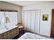 Bedroom featuring dresser and closet at 4352 Tahitian Gardens Cir # E, Holiday, FL 34691
