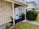 Charming entrance with stone accents, grill, and manicured yard at 4352 Tahitian Gardens Cir # E, Holiday, FL 34691