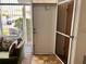 Property entrance featuring screen door, and outdoor seating area with view to outdoors at 4352 Tahitian Gardens Cir # E, Holiday, FL 34691