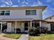 Charming two-story townhome with stone accents, walkway and manicured yard at 4352 Tahitian Gardens Cir # E, Holiday, FL 34691