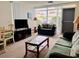Cozy living room with comfortable seating and ample natural light at 4352 Tahitian Gardens Cir # E, Holiday, FL 34691