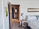 Bright main bedroom with comfortable furnishings and closet access at 4352 Tahitian Gardens Cir # E, Holiday, FL 34691
