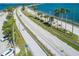 Aerial view shows the Dunedin Causeway with car and pedestrian traffic and waterfront views at 458 Grant St, Dunedin, FL 34698