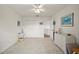 A light and airy bedroom with neutral carpet, ceiling fan, double door closet and outdoor access at 458 Grant St, Dunedin, FL 34698