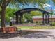 Inviting city park with a gazebo, benches, and scenic greenery, perfect for relaxation and community events at 458 Grant St, Dunedin, FL 34698