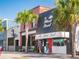Charming exterior view of local restaurant storefronts with pedestrian access and palm trees at 458 Grant St, Dunedin, FL 34698