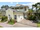 Inviting townhome with a private driveway and a balcony overlooking lush landscaping at 458 Grant St, Dunedin, FL 34698