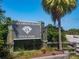 Honeymoon Island sign with nearby Palm, road, foliage and blue skies at 458 Grant St, Dunedin, FL 34698