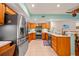 Well-lit kitchen featuring stainless steel appliances, and ample cabinet space at 458 Grant St, Dunedin, FL 34698