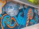 Unique exterior mural of Pisces Sushi & Global Bistro, showcasing a creative and vibrant design at 458 Grant St, Dunedin, FL 34698