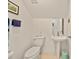 Bathroom powder room with pedestal sink and updated fixtures at 458 Grant St, Dunedin, FL 34698