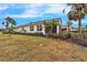 The backyard features well-maintained landscaping and beautiful exterior of the home at 1950 Sterling Glen Ct, Sun City Center, FL 33573