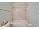 Bathroom features a shower and tub combo at 1950 Sterling Glen Ct, Sun City Center, FL 33573