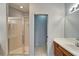 Bright bathroom featuring a glass shower and a vanity with a sink and lots of counter space at 1950 Sterling Glen Ct, Sun City Center, FL 33573