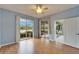 Brightly lit bedroom with sliding glass doors and views of the tranquil lake at 1950 Sterling Glen Ct, Sun City Center, FL 33573