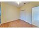 Bedroom with ceiling fan, wood floors, and closet at 1950 Sterling Glen Ct, Sun City Center, FL 33573
