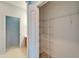 Spacious closet with shelving for ample storage, conveniently located near the bathroom at 1950 Sterling Glen Ct, Sun City Center, FL 33573