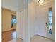 Inviting entryway featuring tiled floors, a closet, and a white front door with sidelight allowing natural light at 1950 Sterling Glen Ct, Sun City Center, FL 33573