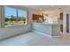 View of the kitchen and dining area with natural light and serene backyard views at 1950 Sterling Glen Ct, Sun City Center, FL 33573