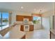 Well lit kitchen features modern appliances and scenic views at 1950 Sterling Glen Ct, Sun City Center, FL 33573