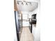 A well-lit kitchen features all-white cabinetry paired with a modern, black appliance set at 207 S Mcmullen Booth Rd # 198, Clearwater, FL 33759