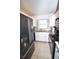 An open kitchen includes black appliances, white cabinets, and granite countertops at 207 S Mcmullen Booth Rd # 198, Clearwater, FL 33759