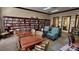 Community library with large bookcases, tables, and comfortable seating at 276 Rochester St, Spring Hill, FL 34609