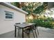 Outdoor dining area with a modern table and chairs, perfect for enjoying meals in the backyard at 4056 18Th S Ave, St Petersburg, FL 33711