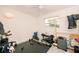 Bedroom featuring ceiling fan, natural lighting, and black rubber floor, converted for use as exercise room at 4056 18Th S Ave, St Petersburg, FL 33711