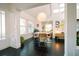 Dining area with adjacent living room and modern lighting at 4056 18Th S Ave, St Petersburg, FL 33711