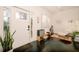 Inviting entryway with natural light, wood floors, and decoratively staged seating area and musical instruments at 4056 18Th S Ave, St Petersburg, FL 33711