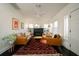 Bright living room features fireplace, tan furniture, area rug and ceiling fan at 4056 18Th S Ave, St Petersburg, FL 33711