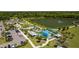 Aerial view of a colorful community splash park and playground with convenient parking at 4154 Pinelake Ln # 101, Tampa, FL 33618