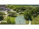 Aerial view of on-site basketball court amidst lush greenery, perfect for active lifestyles and community fun at 4154 Pinelake Ln # 101, Tampa, FL 33618