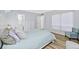 Bright bedroom features a bed, comfortable seating, and ensuite bathroom at 4154 Pinelake Ln # 101, Tampa, FL 33618