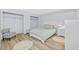 Bright bedroom features a bed, closet and bedside table with neutral decor at 4154 Pinelake Ln # 101, Tampa, FL 33618