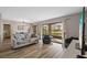 Bright living room with modern furniture and a sliding glass door offering seamless access to the outdoor space at 4154 Pinelake Ln # 101, Tampa, FL 33618