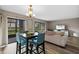 Open-concept living and dining area with waterfront views and modern furnishings at 4154 Pinelake Ln # 101, Tampa, FL 33618