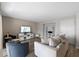 Contemporary living room featuring stylish seating, a large TV, and built-in shelving at 4154 Pinelake Ln # 101, Tampa, FL 33618