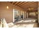 A screened patio shows the entry to the living room through sliding glass doors at 4154 Pinelake Ln # 101, Tampa, FL 33618