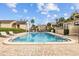 Well-maintained community pool surrounded by lush landscaping at 4154 Pinelake Ln # 101, Tampa, FL 33618