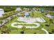 Aerial view of community skate park surrounded by lush landscaping and green space at 4154 Pinelake Ln # 101, Tampa, FL 33618