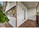Outdoor deck overlooking the backyard with wooden flooring and white siding at 832 13Th N Ave, St Petersburg, FL 33701