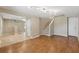 Open floor plan with hardwood flooring connects living spaces, enhanced by recessed lighting at 832 13Th N Ave, St Petersburg, FL 33701