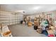Spacious garage with ample storage, shelving, and an automatic door for convenience at 13000 Club Dr, Hudson, FL 34667