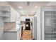 Well-lit kitchen with white cabinets, modern appliances, and a spacious layout at 13000 Club Dr, Hudson, FL 34667